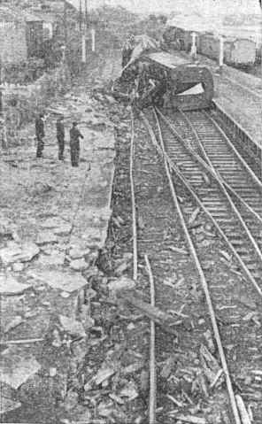 A dramatic view of the scene along the line where the express was derailed - though nine coaches were derailed the giant diesel loco stayed on the lines.