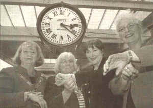 Mayor & Mayoress of Lancaster Eileen Blamire and Jean Yates, Geraldine Smith MP and chairmen of Lancashire County Council Nikki Penney, check their watches against the restored Carnforth Station Clock.