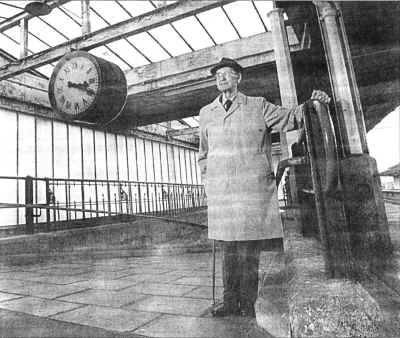 Alf Bergus, who appeared as an extra in Brief Encounter, beneath the clock where tourists still stop to take photographs