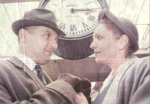 Brief Encounter look-a-likes Trevor Howard and Celia Johnson, under the famous clock at Carnforth Station.  (Photo by Rob Underdown)