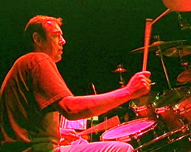 Mark Brzezicki behind his Pearl drum kit.