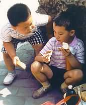 Chubby young Chinese boy and friend.