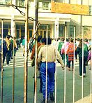 Children behind chained gates.