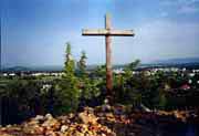 A simple cross on one of the mountains