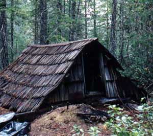 Bailey Cabin near a meadow at the foot of Bailey Peak