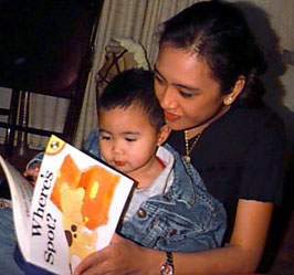 Ninang reading to Phillip