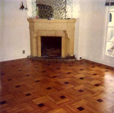 Living Room...all of the floors in the house are in perfect condition. The bedrooms have different pattern. This inlaid/2 tone  parque (?) style is becoming very rare to find.  