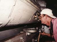 John sights through the rangefinder