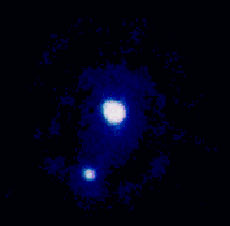 Pluto is too distant to clearly make out any surface features