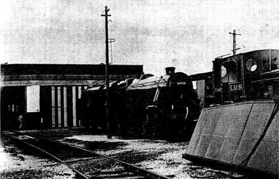 An immaculate "Black 5" No 44932 pauses outside the shed.