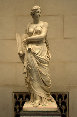 A tall sculpture of Calliope, Muse of epic poetry