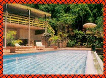 Outdoor grill and eating area located under the upper deck