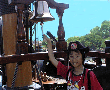 Tomoki ringing the ship bell at Disneyland