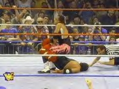 Bret locks the Sharpshooter on Jerry the King Lawler