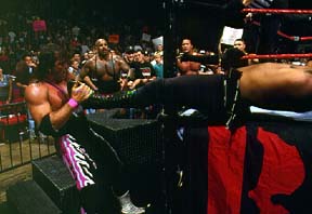 Bret Sets HHH Up For Figure Four (Over The Rope) 