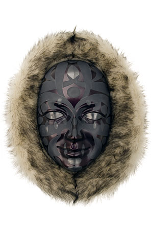 Mask: Face1067
Artist: Brian Zenk
Artist category: Artists/National
About this mask: This mask simply borrows from Northwest Coast art, the most elegant in the world. That gorgeous tradition can't be improved upon, so I keep going back to it. As Thanksgiving approached I thought of the Arctic and Northwest people's relationships with the animal world; how they thanked each animal who supplied them with the means to survive, and honored its spirit in the things they made. I imagined a Yup'ik parka, using textile fur, graphite, fabric dye, enamel and wood.
border=