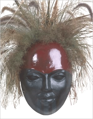 Mask: FACE0706
Artist: Pacific Northwest Ballet
Artist category: Artists/Local
About this mask: Created by Brian Zenk for the Pacific Northwest Ballet. The Rite of Spring This face borrows traditional Northwest coastal native colors and Maori moko facial tattoo. The chin moko signified power, standing and availability among Maori women. The war and fertility symbols combined with natural elements recall themes of the ballet 