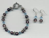 Hand beaded bracelet of aqua swarovski crystals and handmade glass beads