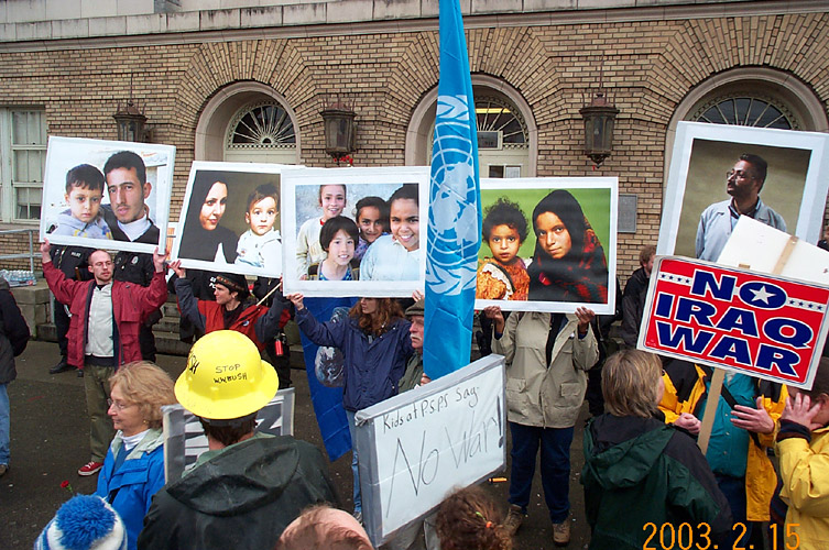 Protesters Hold Up Photographs of Detainees, and Tell Their Stories