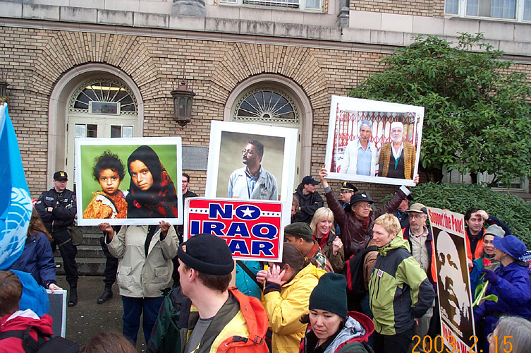 Protesters Hold Up Photographs of Detainees, and Tell Their Stories