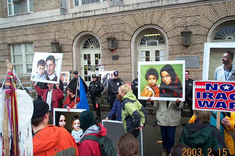 Protesters Hold Up Photographs of Detainees, and Tell Their Stories