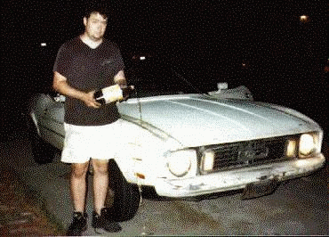 Christening the car with homemade beer.