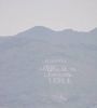 Words on the side of a mountain done with rocks.  Some people just have too much time..