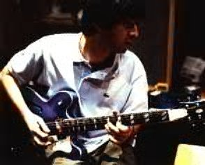 Noel with his guitar.
