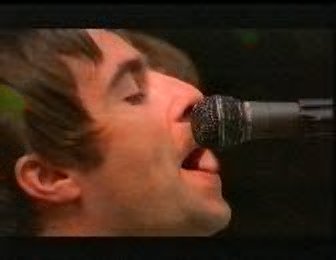 Liam singing into the microphone.