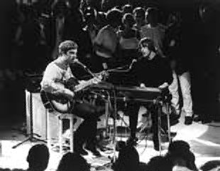 Noel playing guitar with Paul Weller.