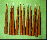 Illustration of rolled and tapered beeswax candles 