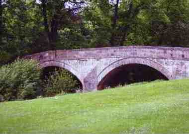 The Ewes water flows under the Sawmill Bridge