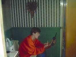 Joe taking a dump!  His mom on the phone.