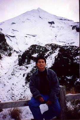 The snow-draped Mt. Taranaki waits to be conquered by a novice skier.