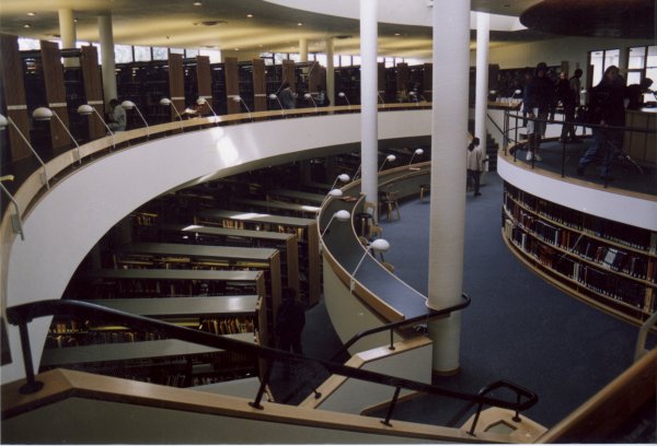 Photo from the entry floor at the focus of the library, looking down into the lower floor. The opening allows much sunlight to filter into the lower floors.