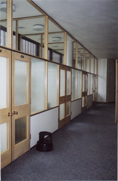 Photo of study rooms along the back wall at the opposite end from the study carrols.