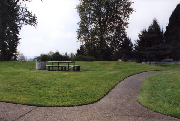 Photo north of site; benches between offices and condos.