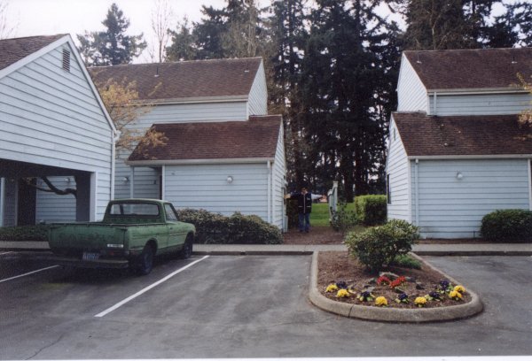 Photo of other side of condos (park in background). I am the scale figure with my arms outstreched.