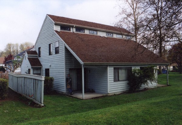 Photo from the park facing a single condo. I am the scale figure under the overhang.