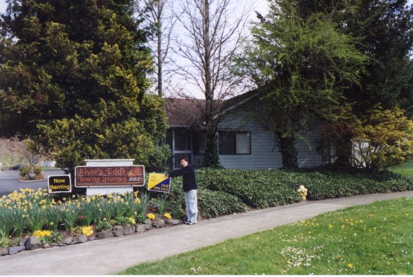 Photo of the street view of the office with Gary as the scale and contexual figure.