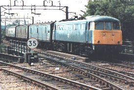 85034 nears Northampton station on a parcels working