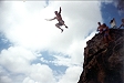 Adam jumping off the cliff.