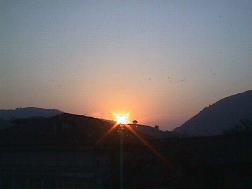 while the sun is hiding behind the mountain...