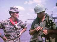 Mike Force SFer talking to Dennis Wagner, Manchu machinegunner.