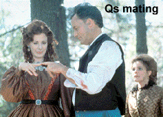 Captain Janeway looks on as Q and the female Q mate - Kate Mulgrue - John deLancie - Susie Plakson