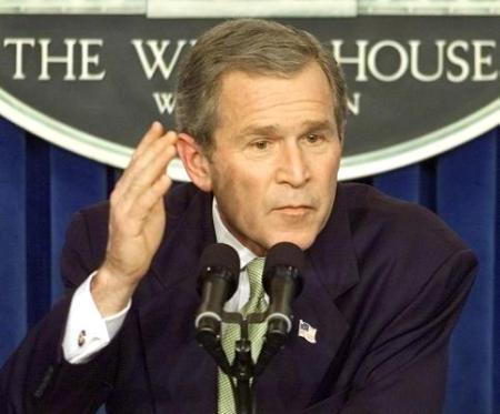 President Bush speaks at a news conference Wednesday, March 13, 2002, in the briefing room at the White House. President Bush said his administration has all options on the table as the Pentagon reworks its nuclear weapons policy to deter any attack on America, including from non-nuclear states such as Iraq and Iran. (AP Photo/Ron Edmonds)